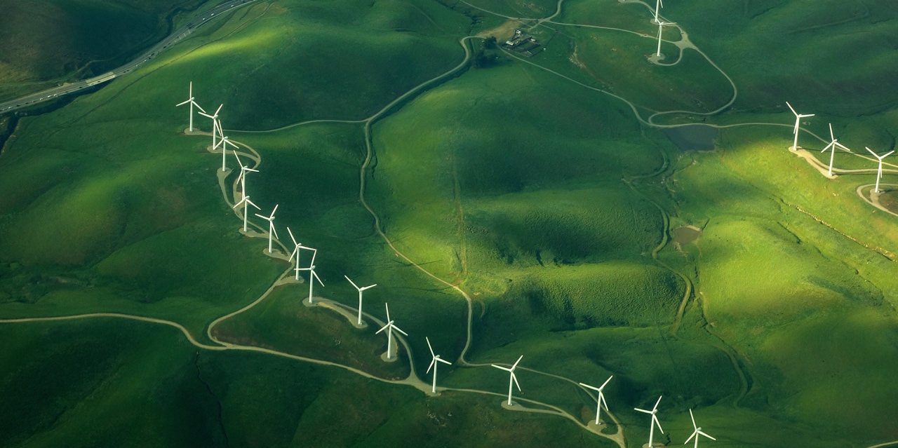 beautiful green aerial view of windmill farm providing eco-friendly energy sustainabilityÂ 