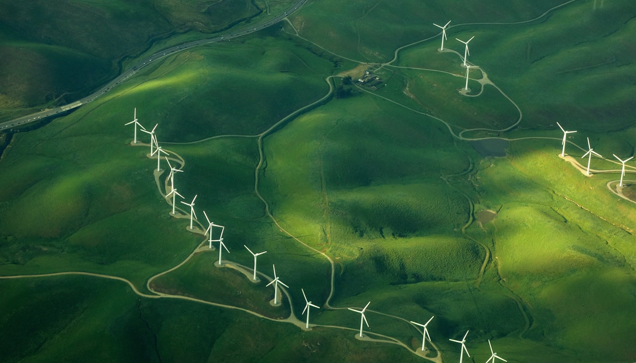 beautiful green aerial view of windmill farm providing eco-friendly energy sustainabilityÂ 